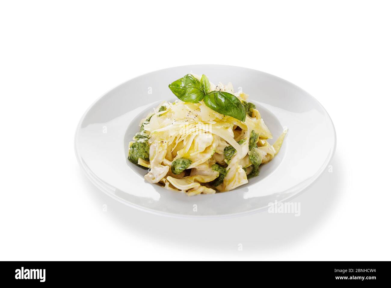 Basil Pesto Pasta isolated white background Stock Photo