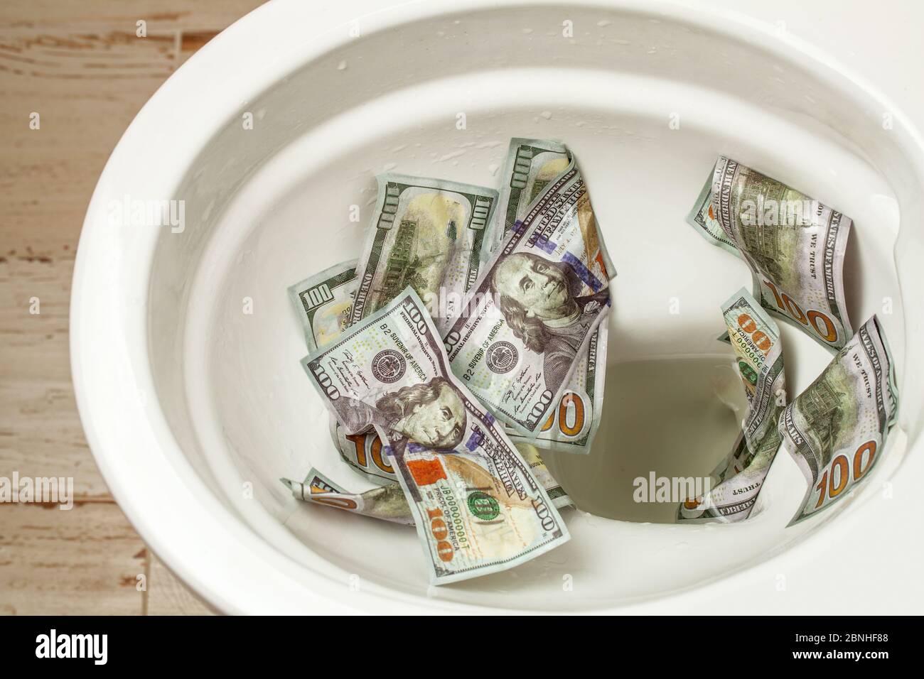 Flush money down the toilet hires stock photography and images Alamy