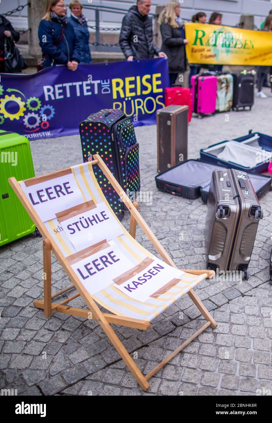 Schwerin, Germany. 13th May, 2020. Empty deckchairs are used by employees of travel agencies and tourism businesses to demonstrate in front of the state chancellery for an exit strategy from the Corona crisis. From 25 May onwards, the coach industry may offer tours again, but the conditions are still completely unclear. Credit: Jens Büttner/dpa-Zentralbild/ZB/dpa/Alamy Live News Stock Photo