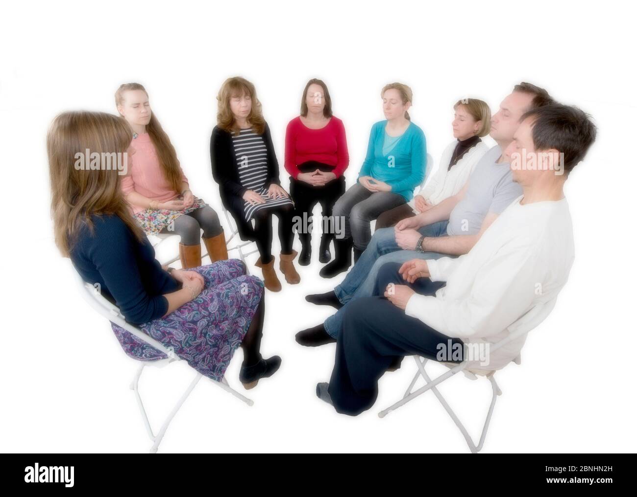 A calming and therapeutic group meditation session in England. Stock Photo