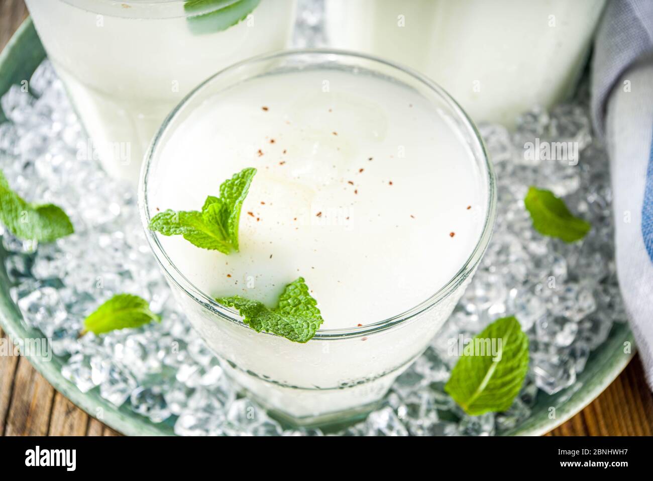 Cold Indian drink Lassi, iced coconut Lassi drink with mint leaf