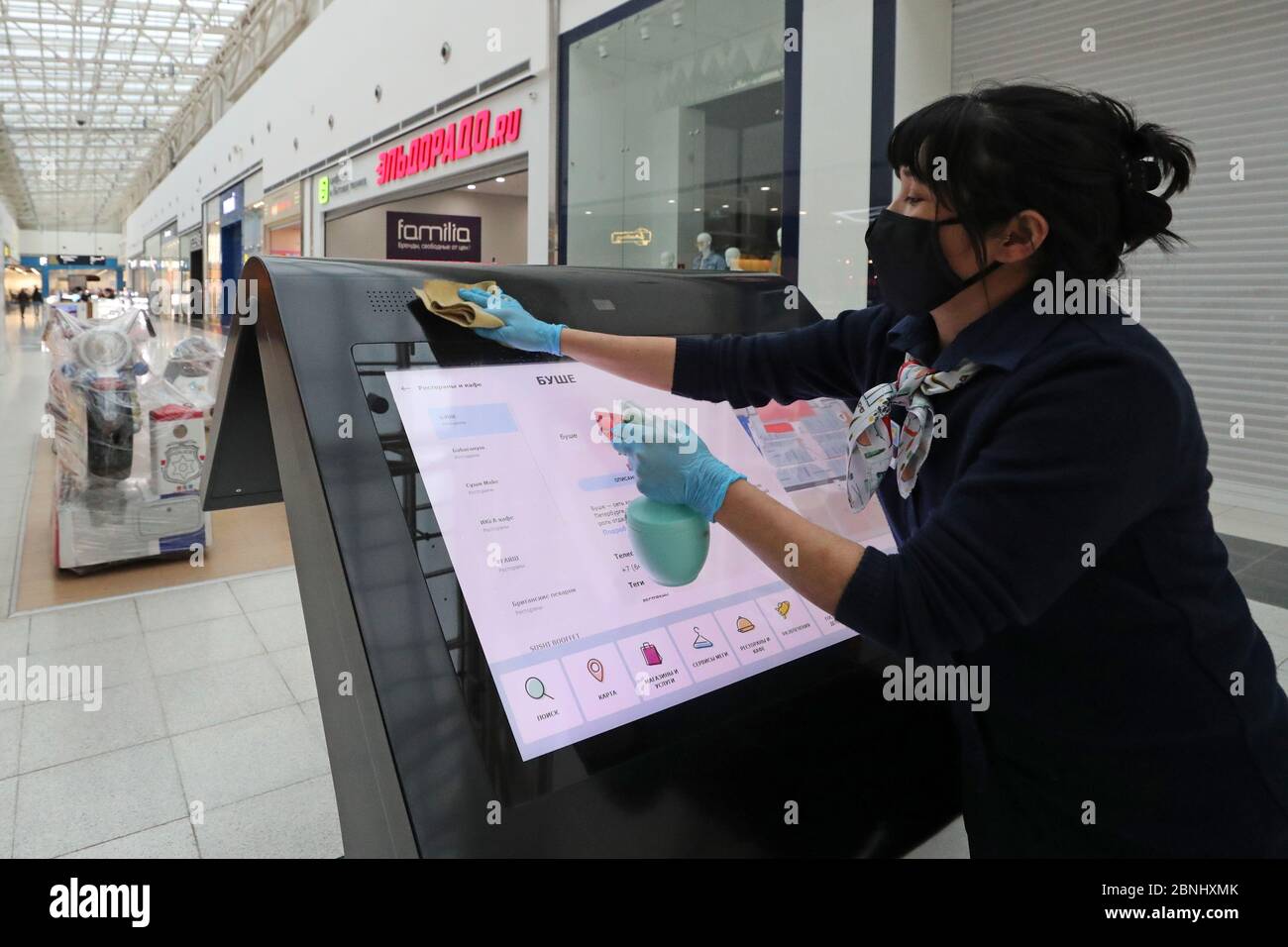 Leningrad Region Russia May 15 2020 An Employee Disinfecting An Information Kiosk At The Mega Parnas Shopping Mall Starting May 15 St Petersburg S Shopping Complexes Mega Parnas And Mega Dybenko Are