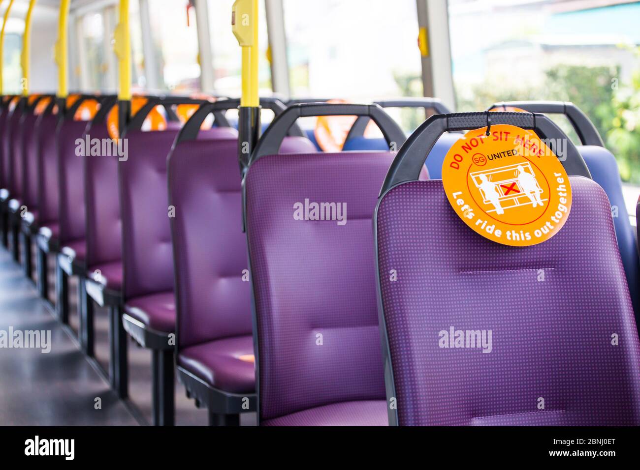 Safety distancing in place on a bus during this coronavirus pandemic, singapore Stock Photo