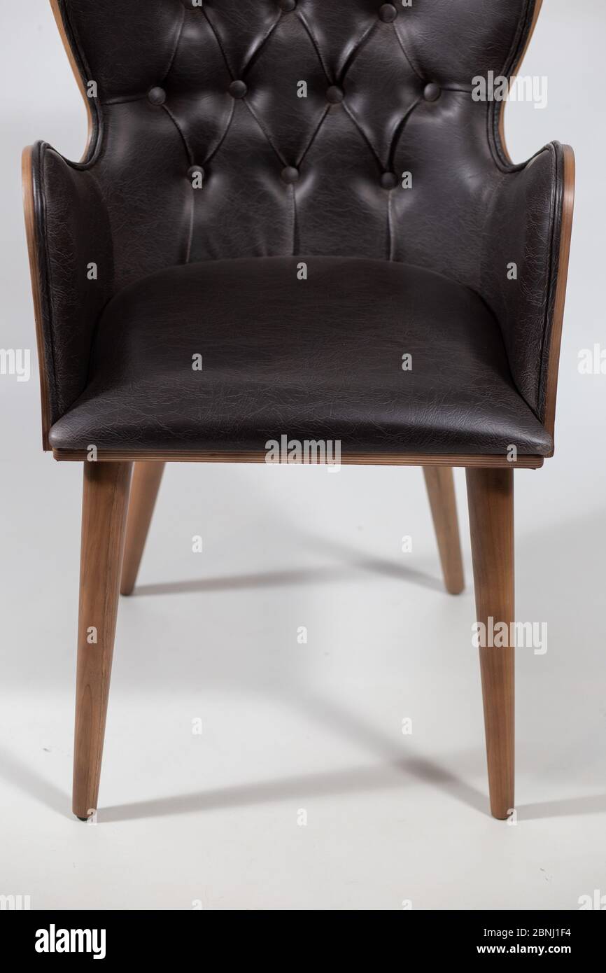 Black leather armchair placed on a white background Stock Photo - Alamy