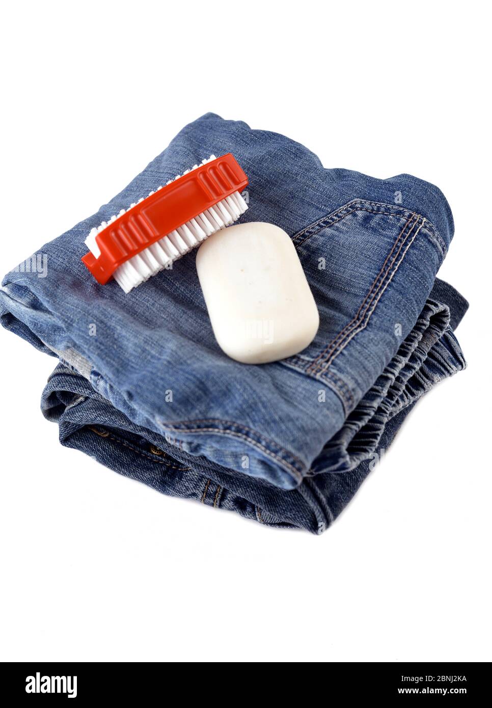 Blue jeans with soap and brush cleaning concept Stock Photo Alamy