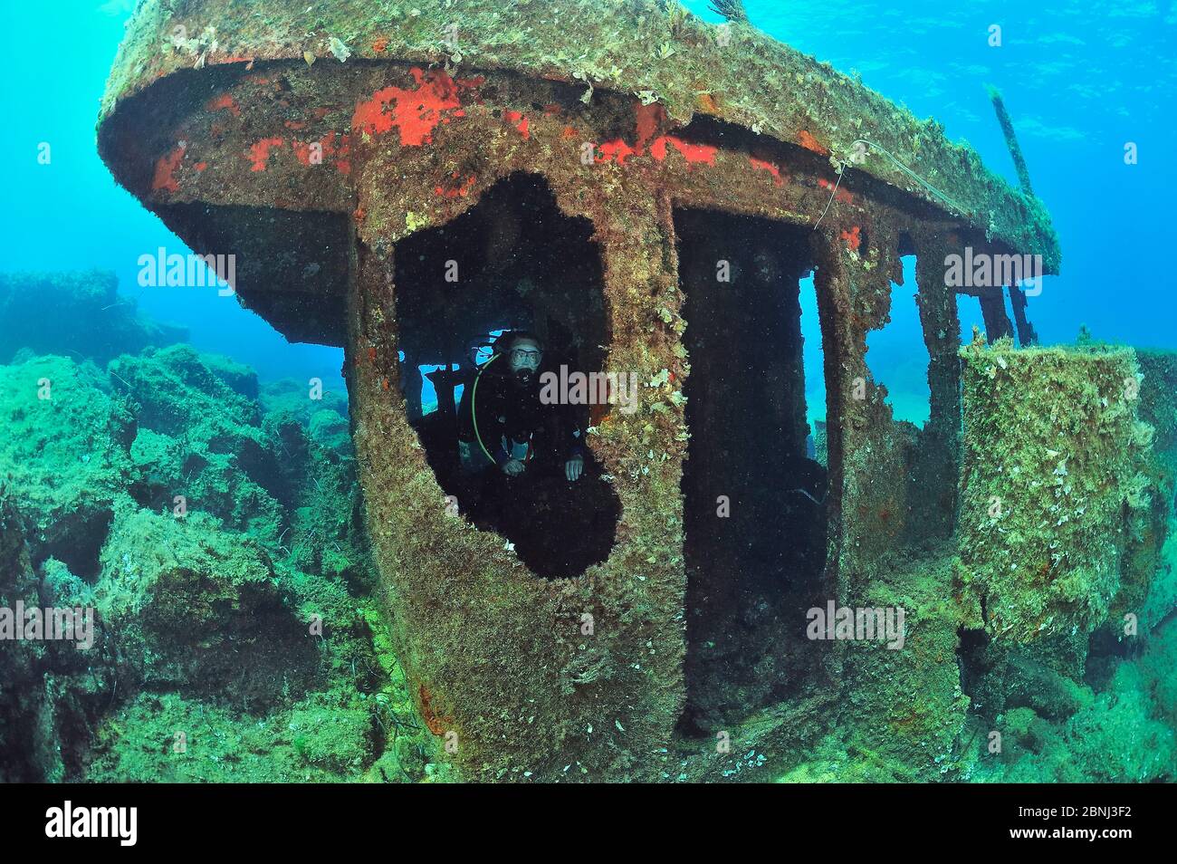 A diver on the wreck of the Vera K, a Lebanese freighter, sunk in 1974 on the reef near Paphos, Cyprus, Mediterranean Sea Stock Photo