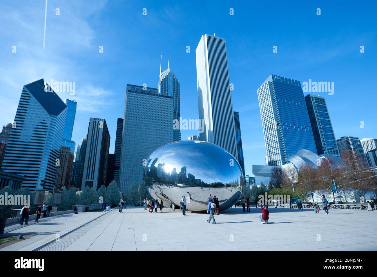 Chicago, Illinois, United States - Skyline of buildings and tourists at Millennium Park at downtown. Stock Photo