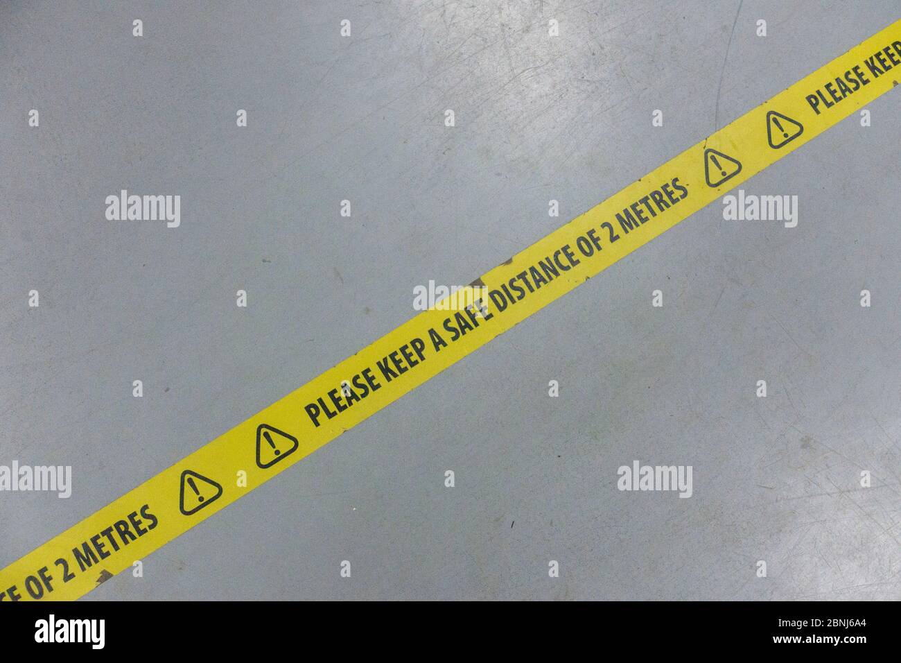 West Norwood, UK. 15th May, 2020. Social distancing tape, with the message 'Please Keep A Safe Distance Of 2 Metres' on the floor at a DIY superstore in South London. (photo by Sam Mellish / Alamy Live News) Stock Photo