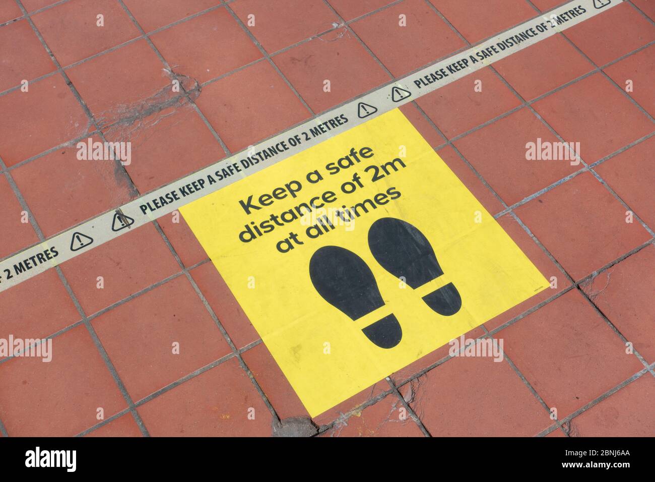 West Norwood, UK. 15th May, 2020. Social distancing tape, with the message 'Please Keep A Safe Distance Of 2 Metres' on the floor at a DIY superstore in South London. (photo by Sam Mellish / Alamy Live News) Stock Photo