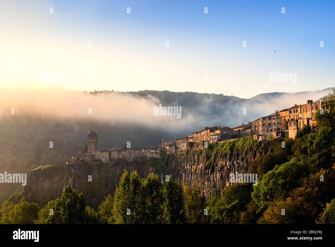 The clifftop village of Castellfollit de la Roca in the morning light, Garrotxa, Girona, Catalonia, Spain, Europe Stock Photo