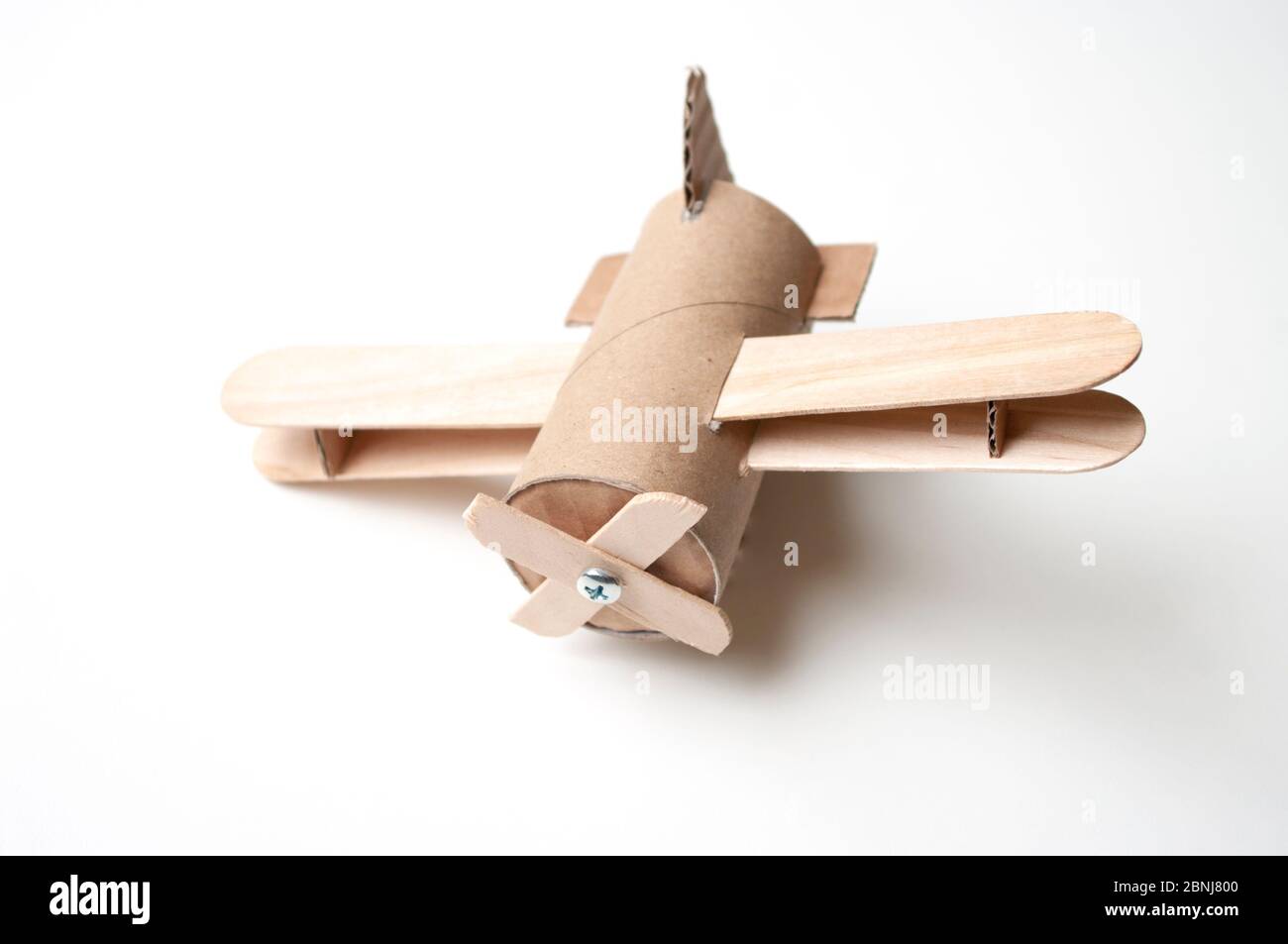Hand made toy aircraft from toilet roll and sticks. Diy for kids and parents. Airplane. Stock Photo