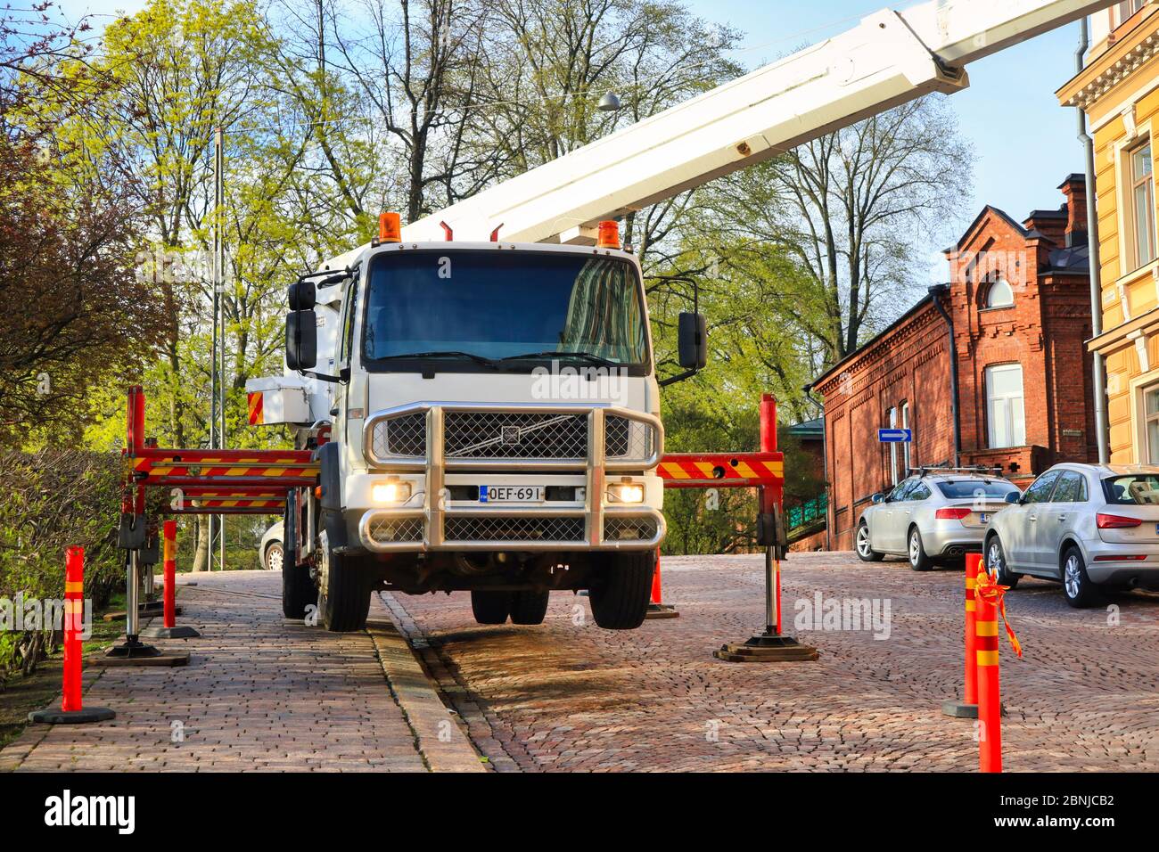 Hydraulic truck crane raised on outriggers, keeping the crane stable