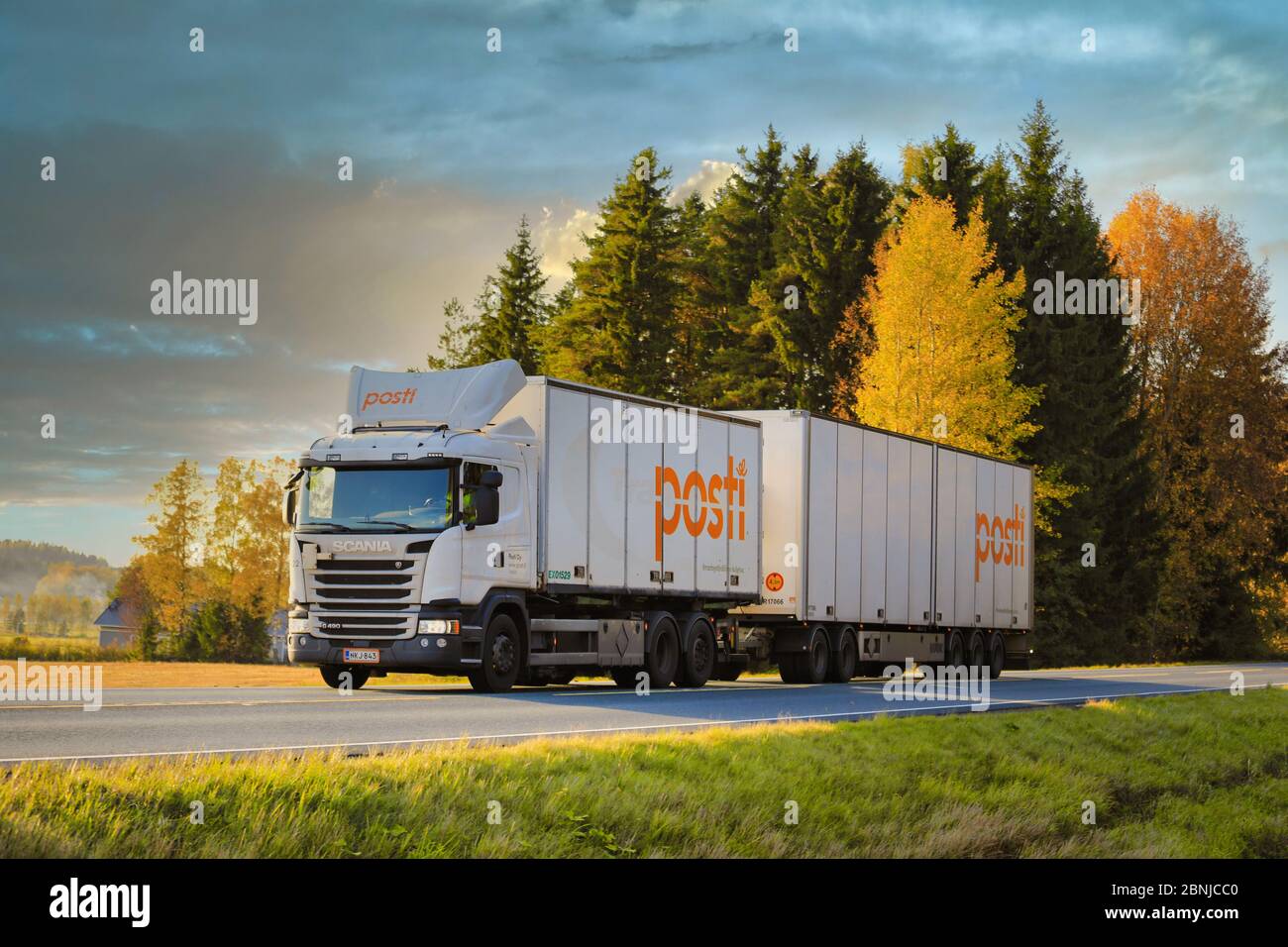 White Scania G490 truck for the deliveries of Finnish Post, Posti Kuljetus  Oy on highway 2 at beautiful autumn sunset in Humppila, Finland. 2017 Stock  Photo - Alamy