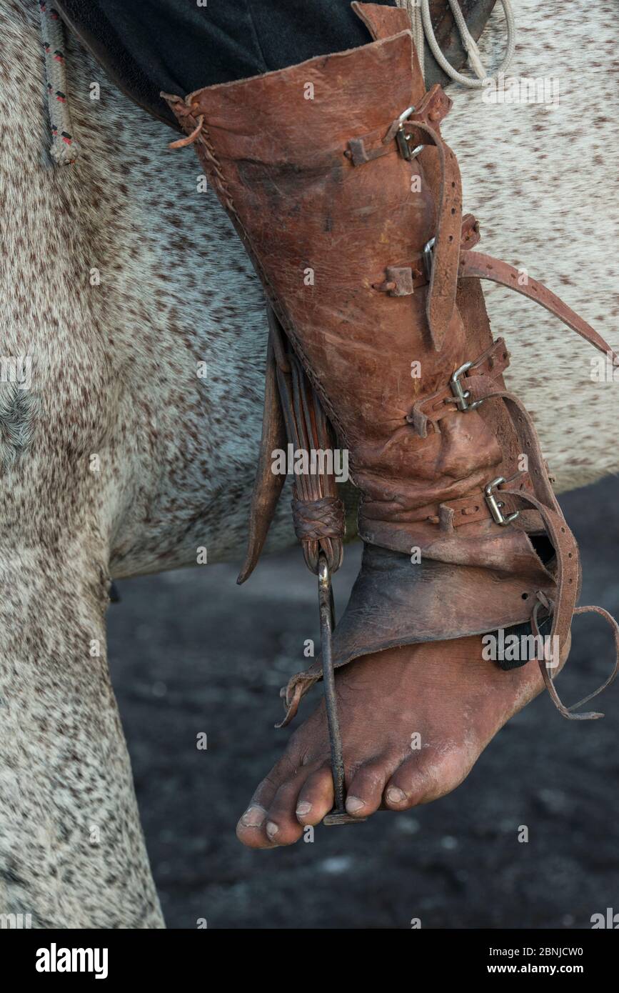 Amerindian cowboy detail of foot and traditional footwear, Rurununi savanna, Guyana, South America Stock Photo