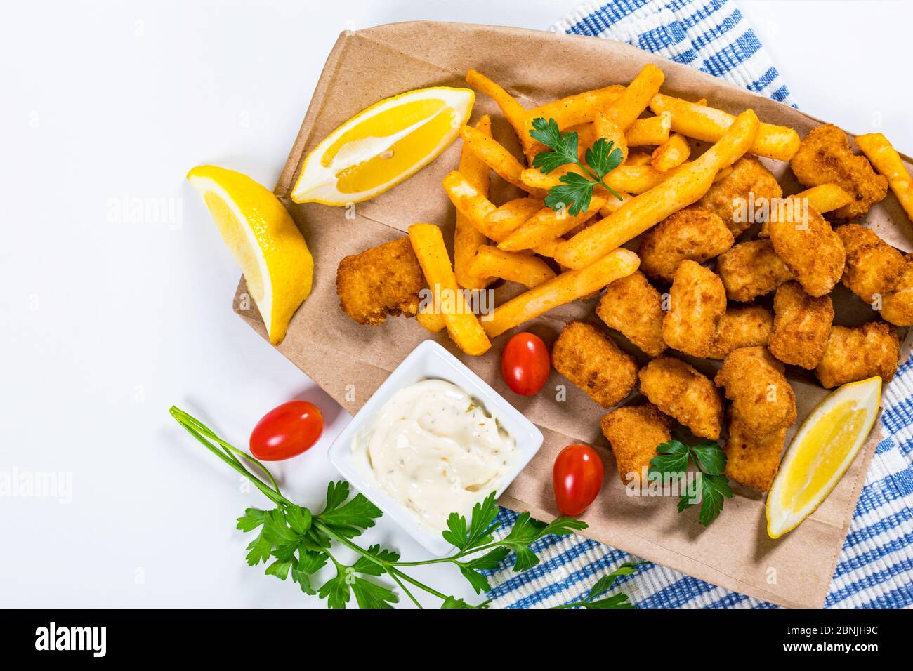 Crispy Fish Bites Snack Size. Deep Fried Pollock Fish Fingers with Tartar  Dipping Sauce Stock Photo - Alamy