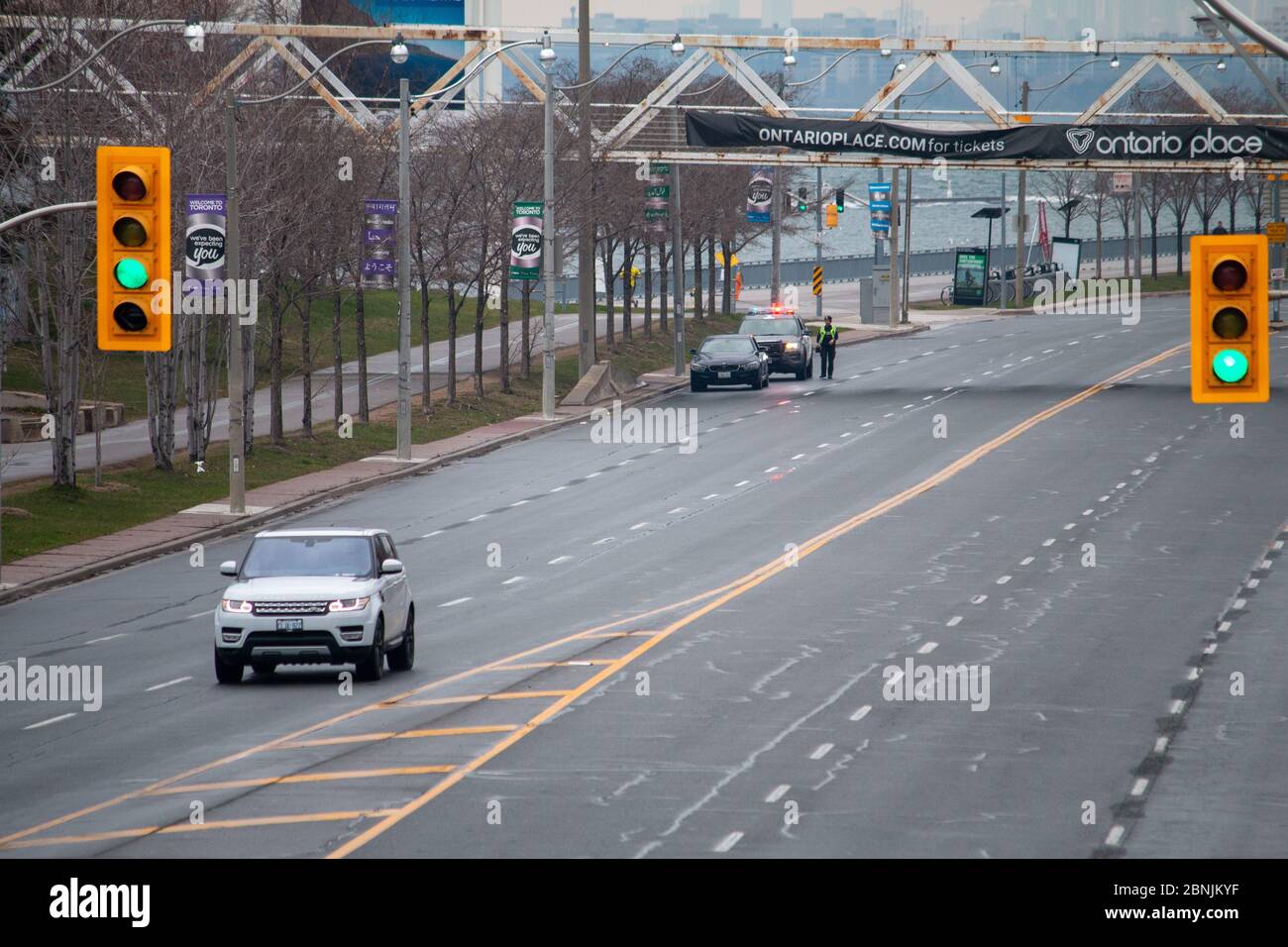 Speeding ticket being issued by police officer on Lakeshore Blvd. in