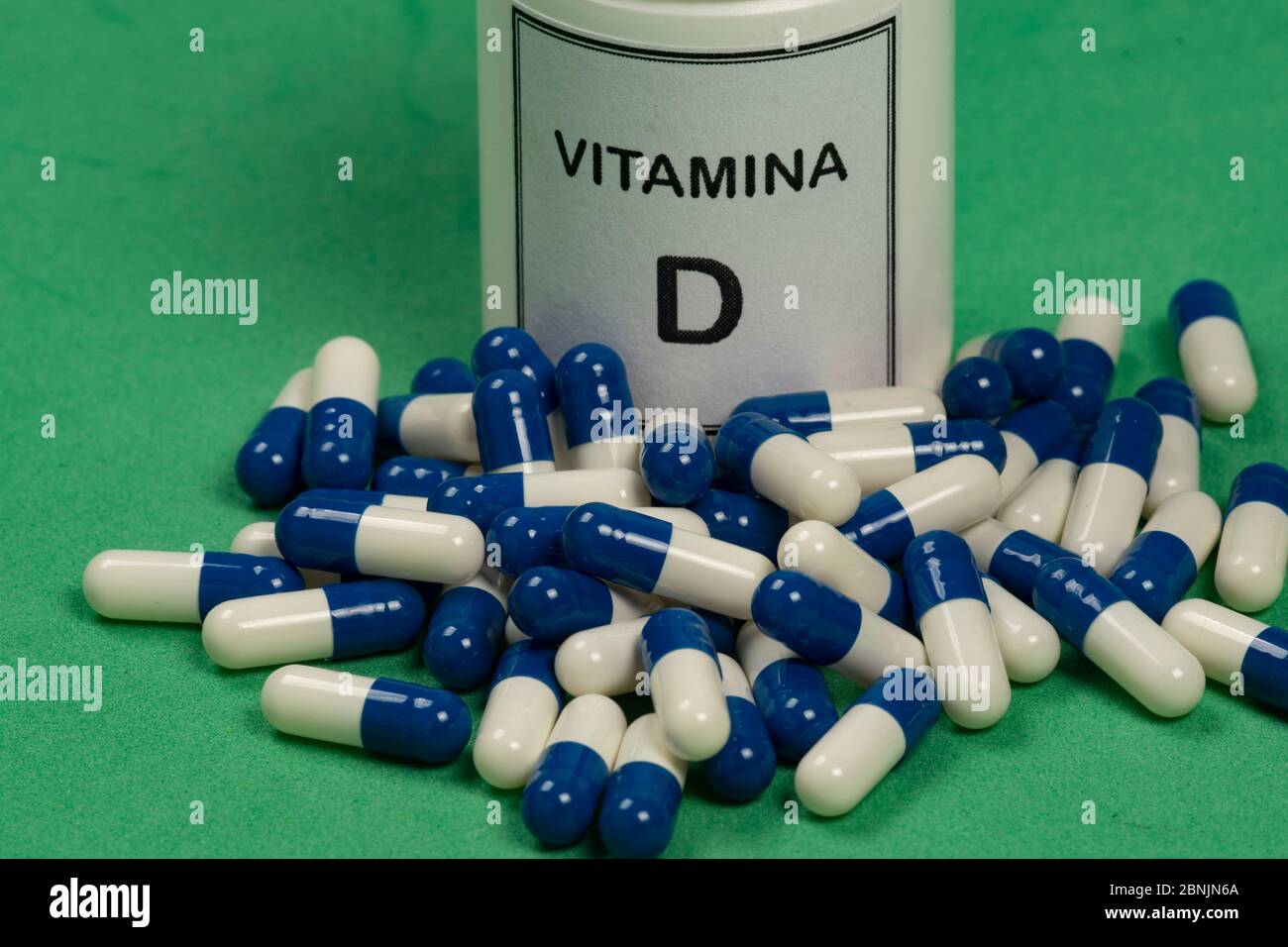 Vitamin D container with capsules around Stock Photo Alamy