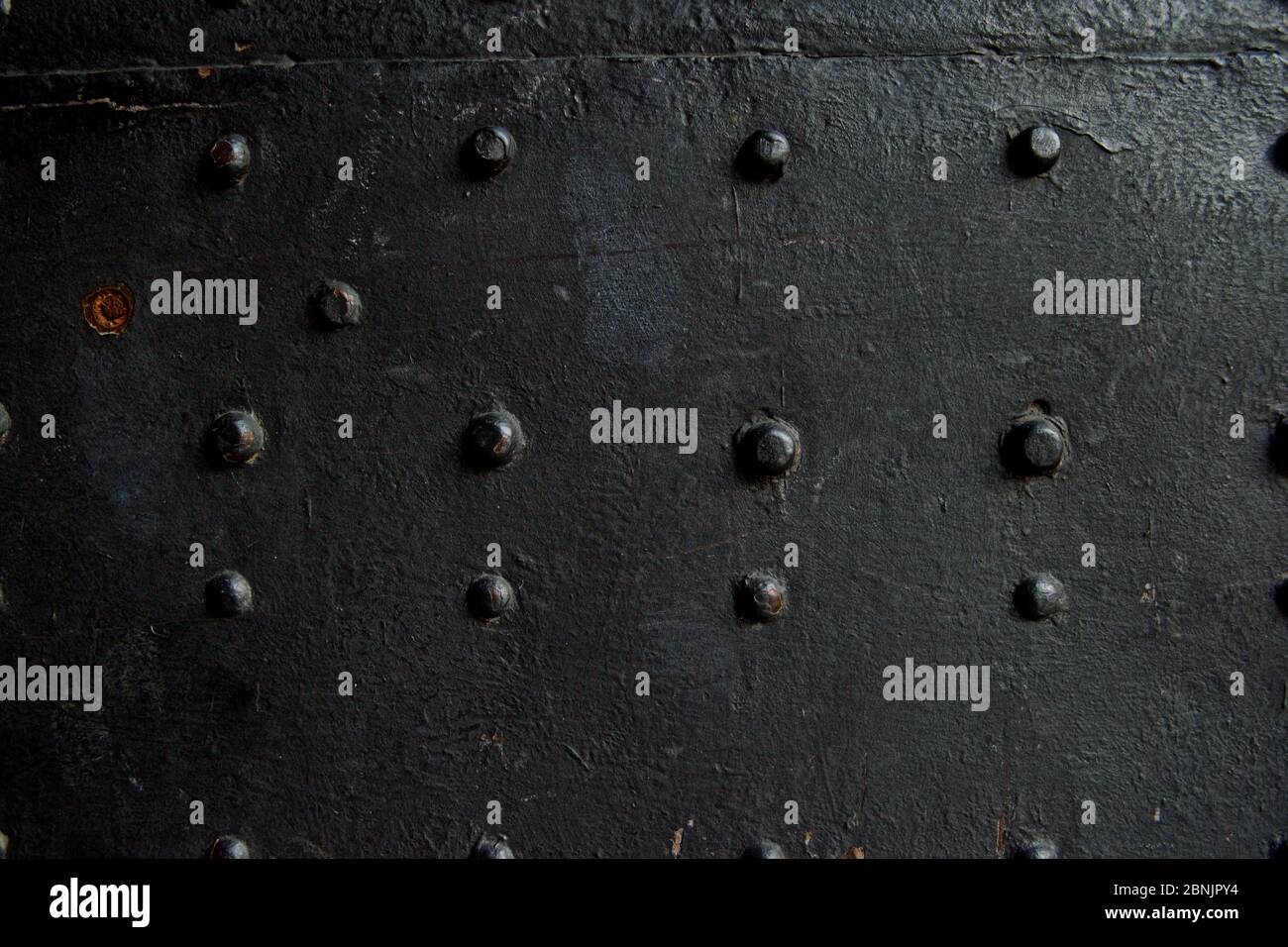 black metal background with rivets Stock Photo - Alamy