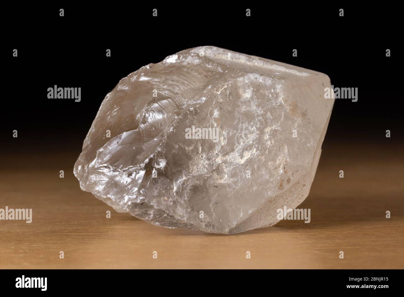 Translucent smoky quartz mineral from Brazil over a wooden table Stock  Photo - Alamy