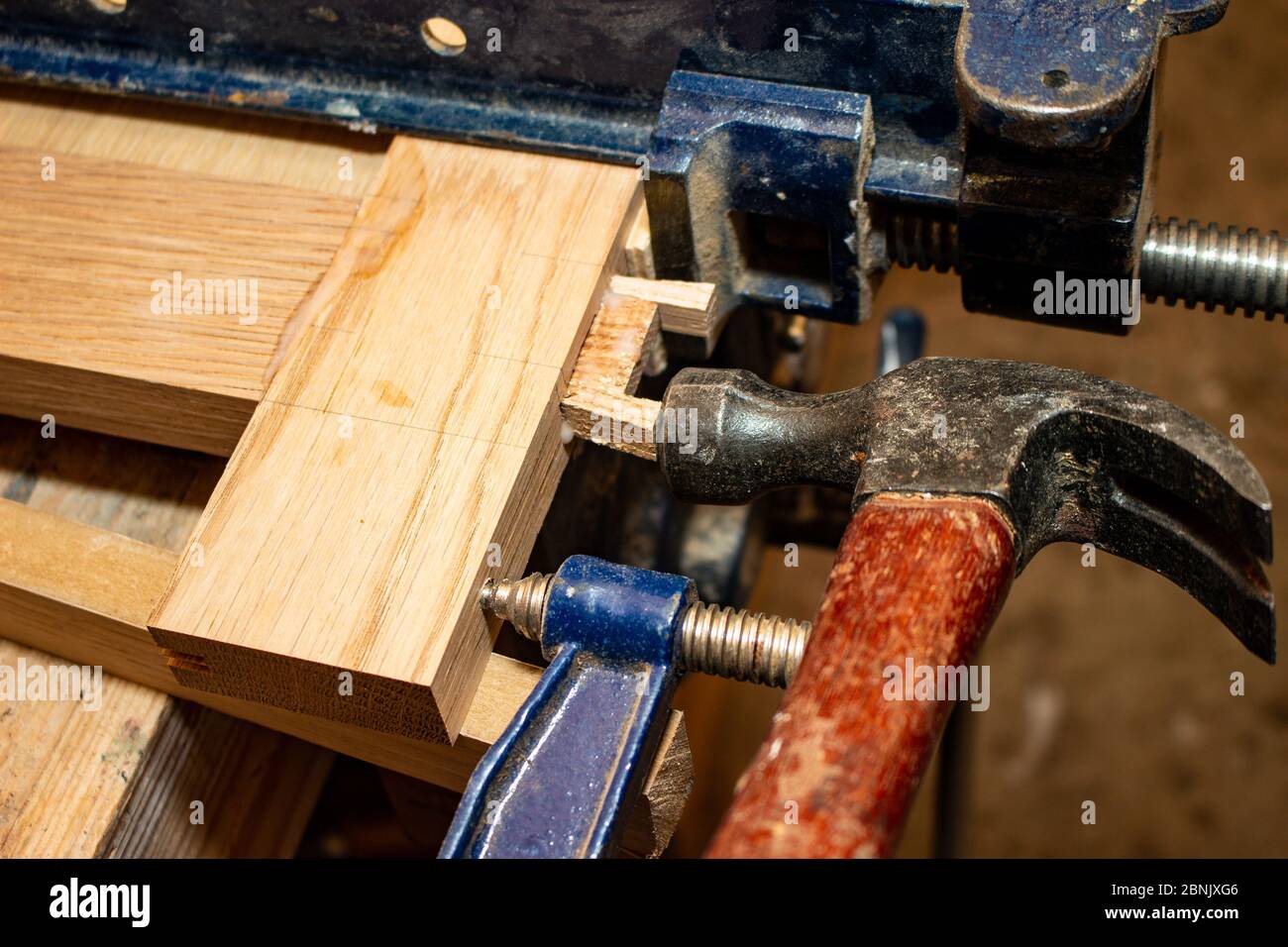 Hammering in a wedge on a mortise and tenon joint, traditional joinery