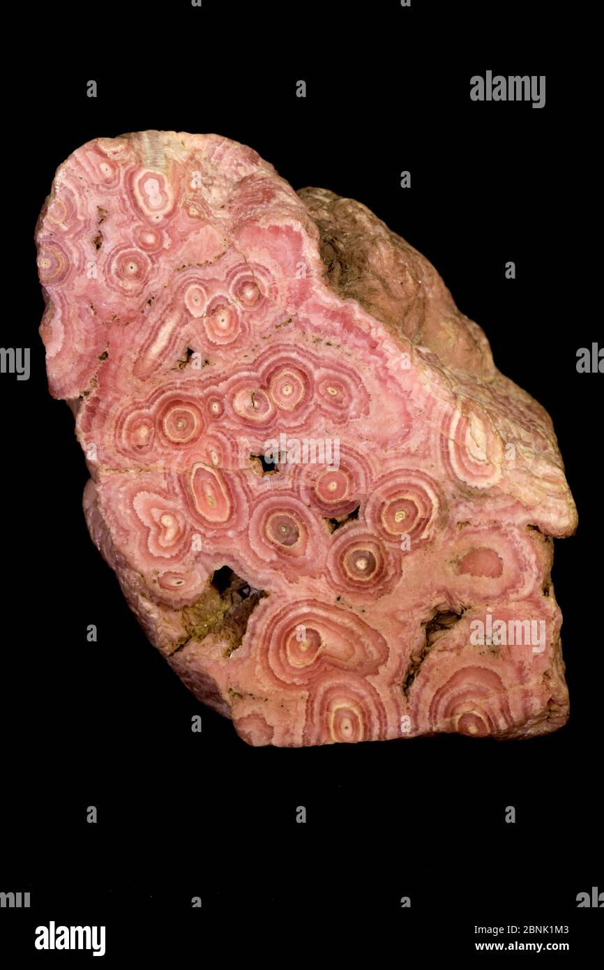 Rhodochrosite a manganese carbonate mineral with chemical composition MnCO3. In its (rare) pure form, it is typically a rose-red color, but impure spe Stock Photo