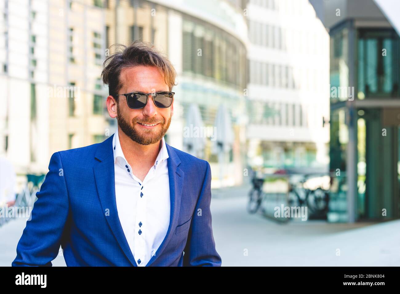 man in suit wearing sunglasses Stock Photo