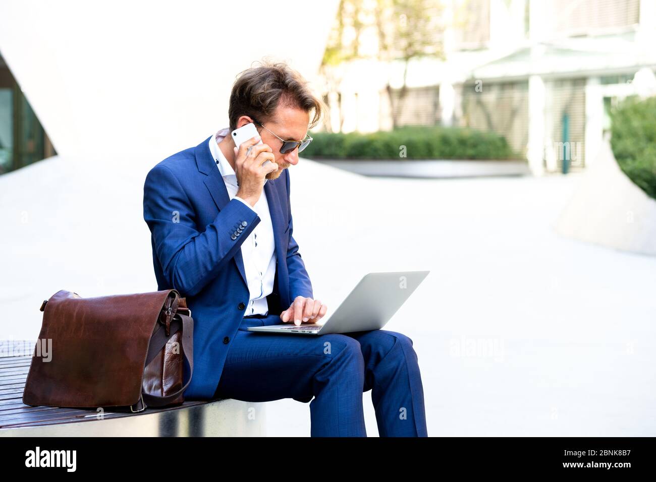 man working outside in Frankfurt Main, Germany Stock Photo