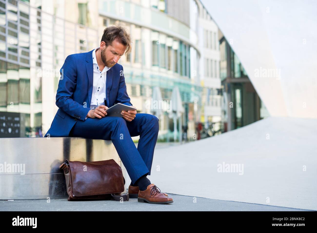 man working outside in Frankfurt Main, Germany Stock Photo
