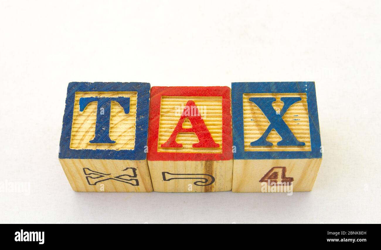 The term tax visually displayed on a clear background in coloured