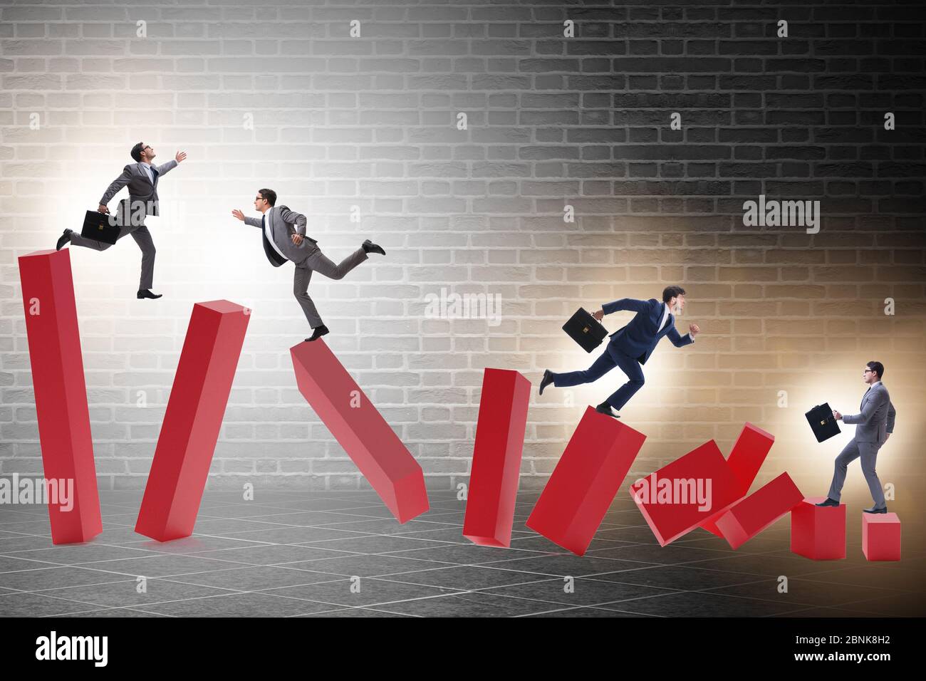 Business people in the collapsing economy concept Stock Photo - Alamy