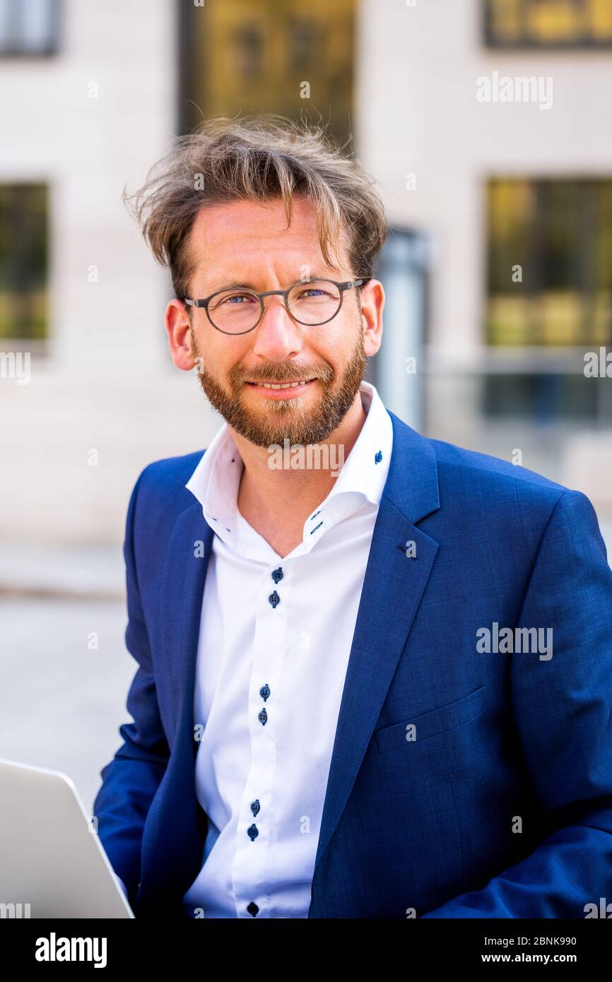 man working outside in Frankfurt Main, Germany Stock Photo
