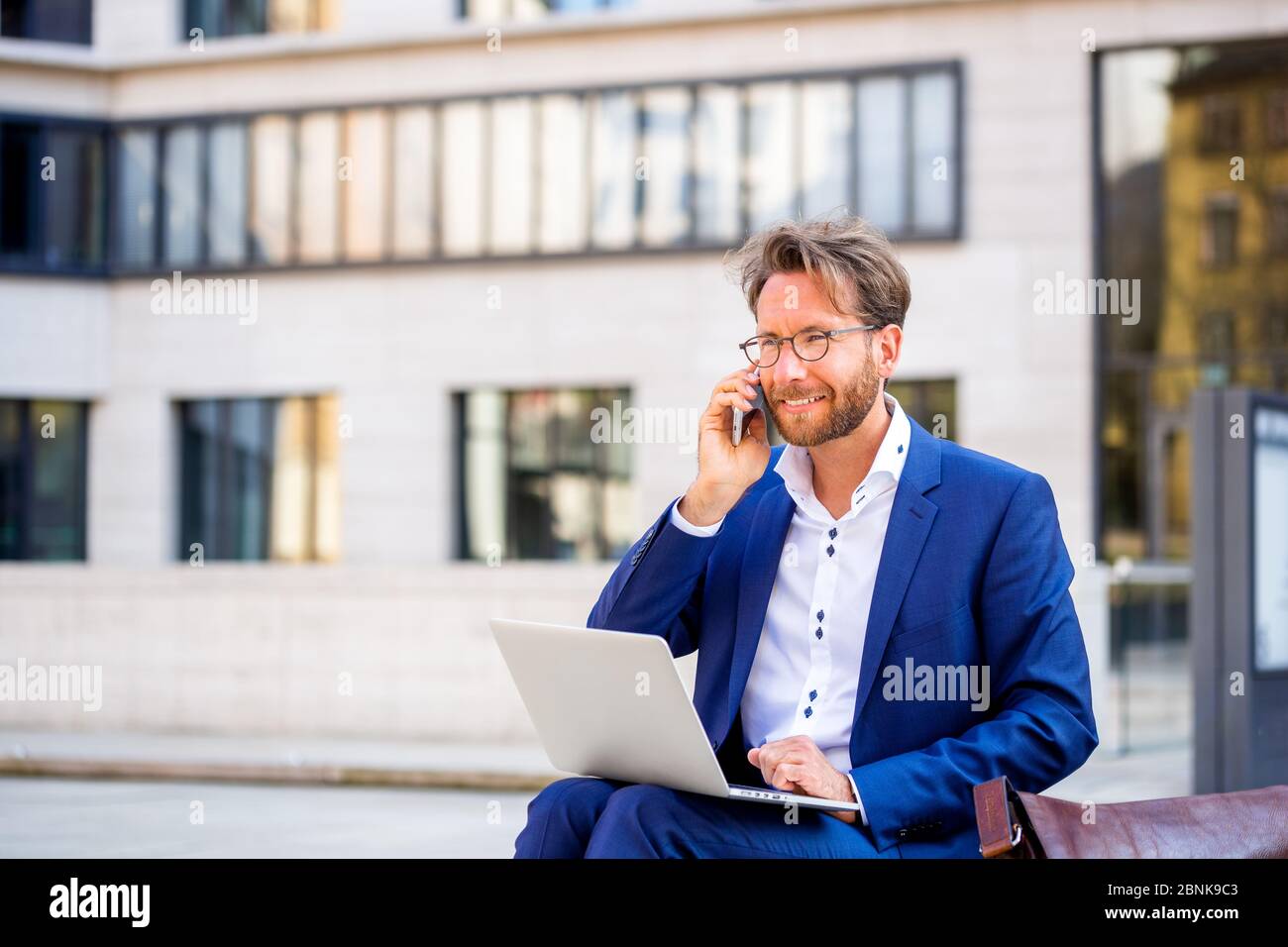 man working outside in Frankfurt Main, Germany Stock Photo