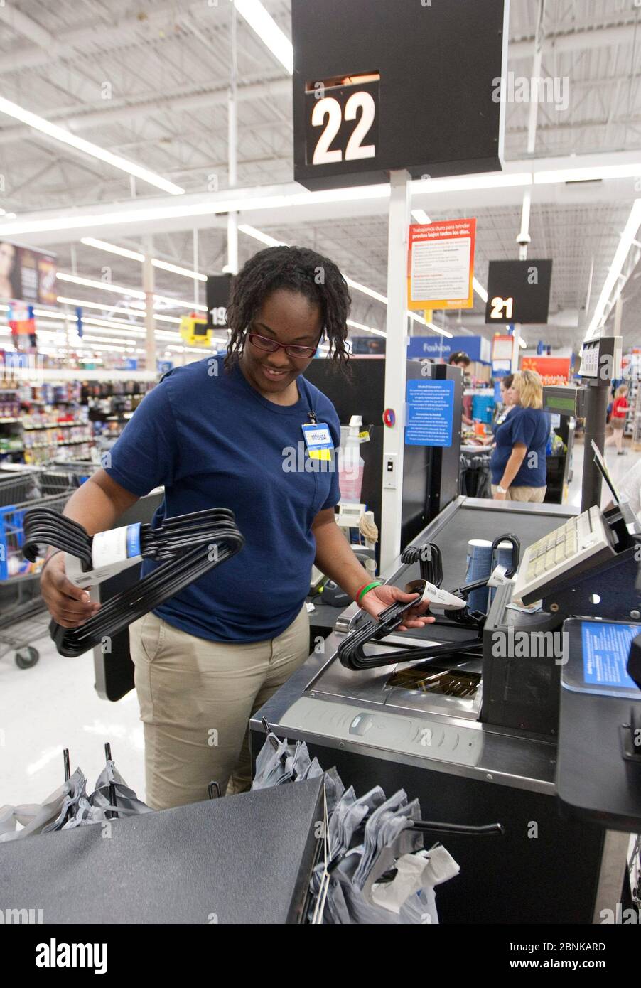 San Marcos, Texas USA, 2012 Smiling AfricanAmerican female cashier
