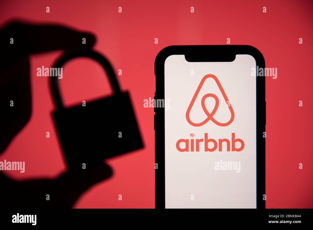 LONDON, UK - May 15 2020: Airbnb home holiday rental logo with security padlock Stock Photo