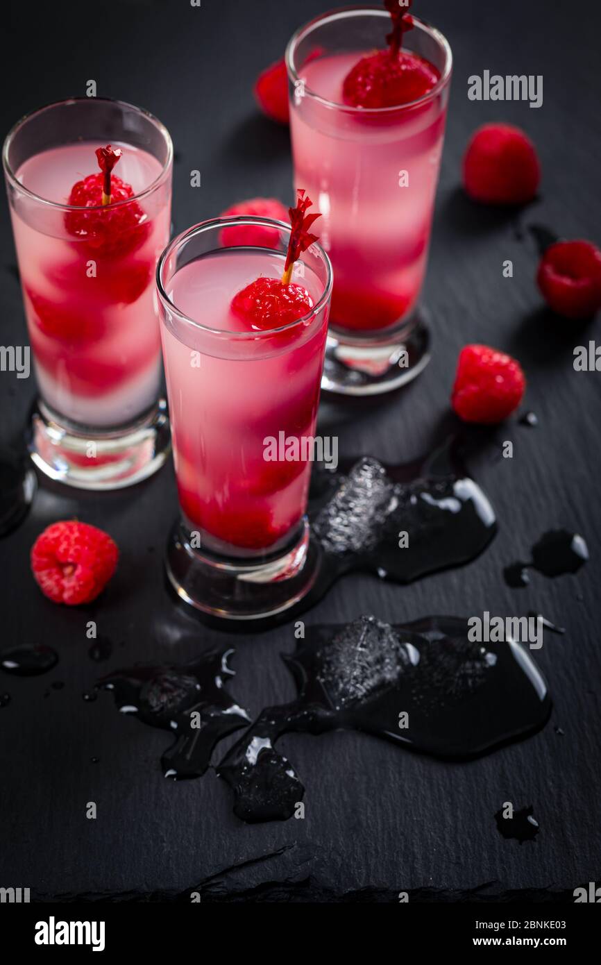 Raspberry Vodka Shots Cocktail with Fresh Raspberry on Black Background ...