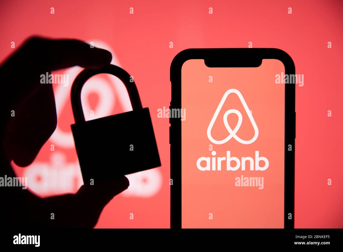 LONDON, UK - May 15 2020: Airbnb home holiday rental logo with security padlock Stock Photo