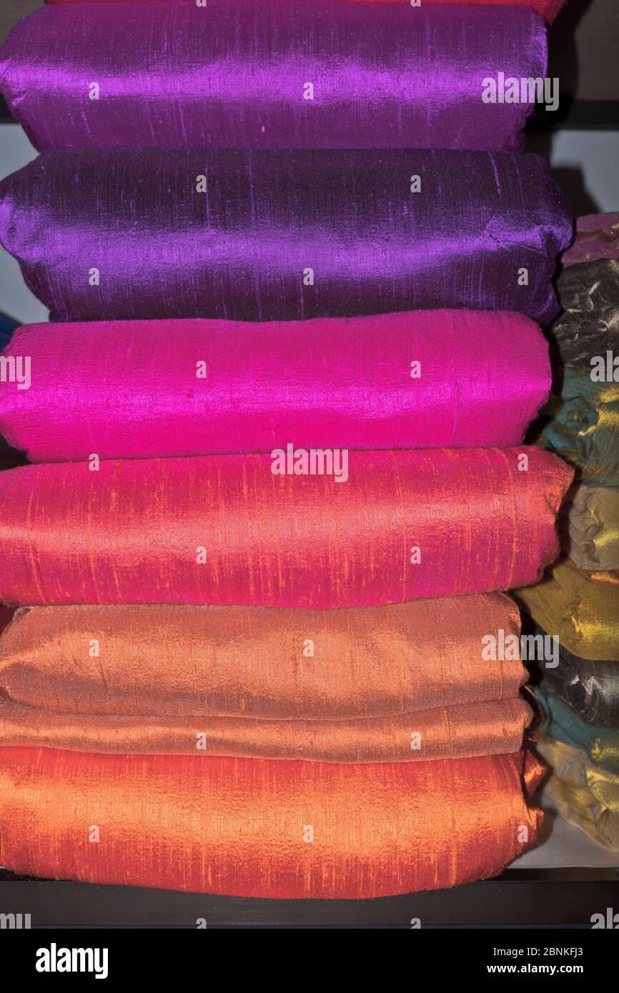 dh Natural Silk Factory shop GALLE SRI LANKA Rolls of colourful silks material cloth store display handmade fabric textile Stock Photo