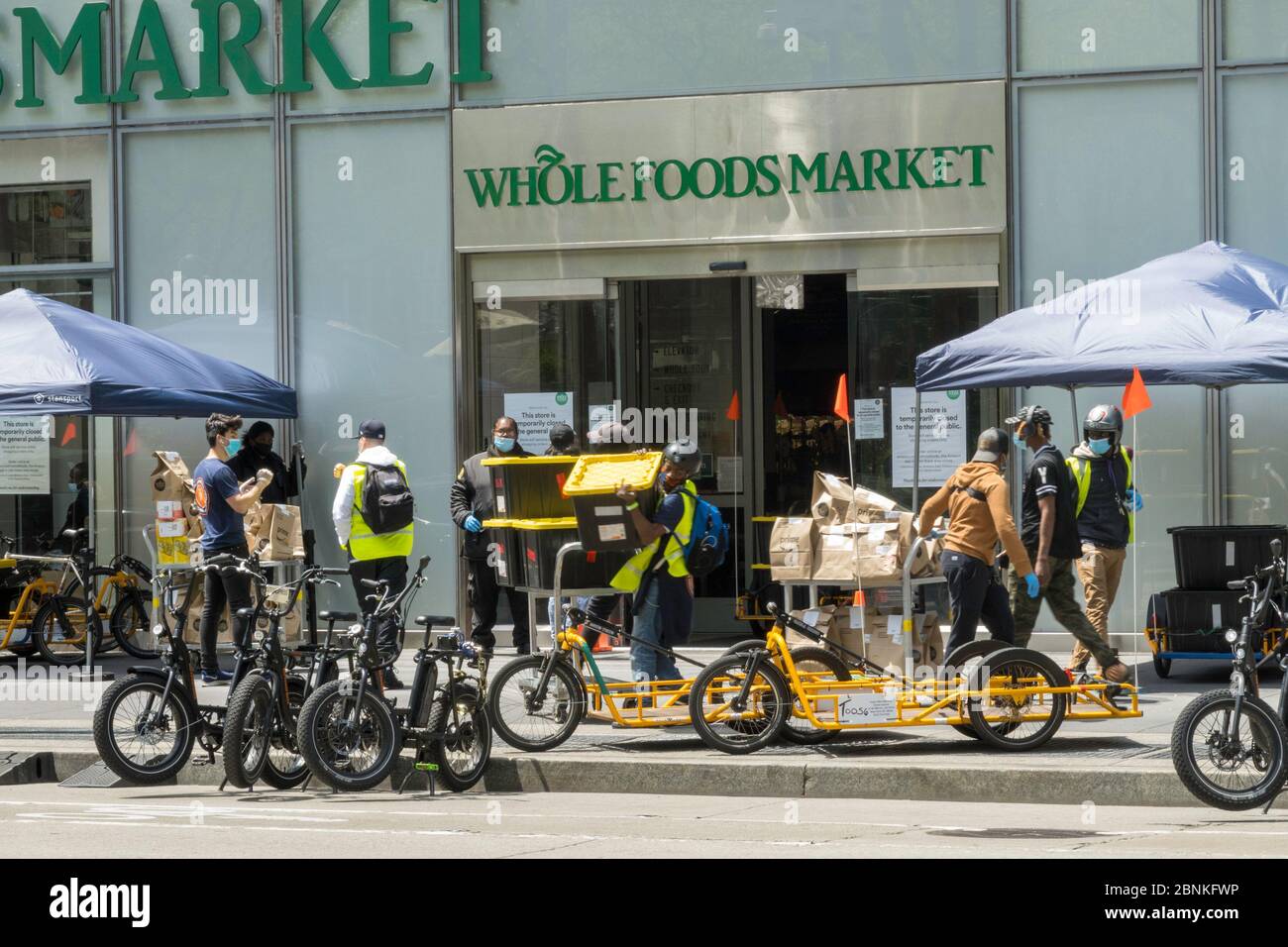 Whole Foods Market employs Carla Cargo trailer with ebike for food delivery in Midtown