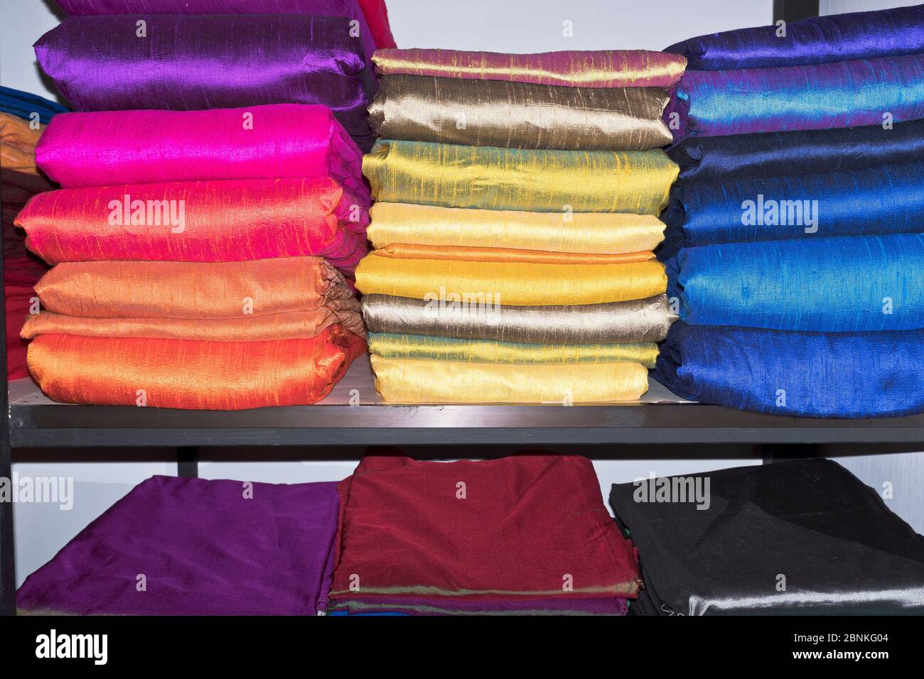 dh Natural Silk Factory shop GALLE SRI LANKA Rolls of colourful silks material cloth store display handmade fabric shops Stock Photo