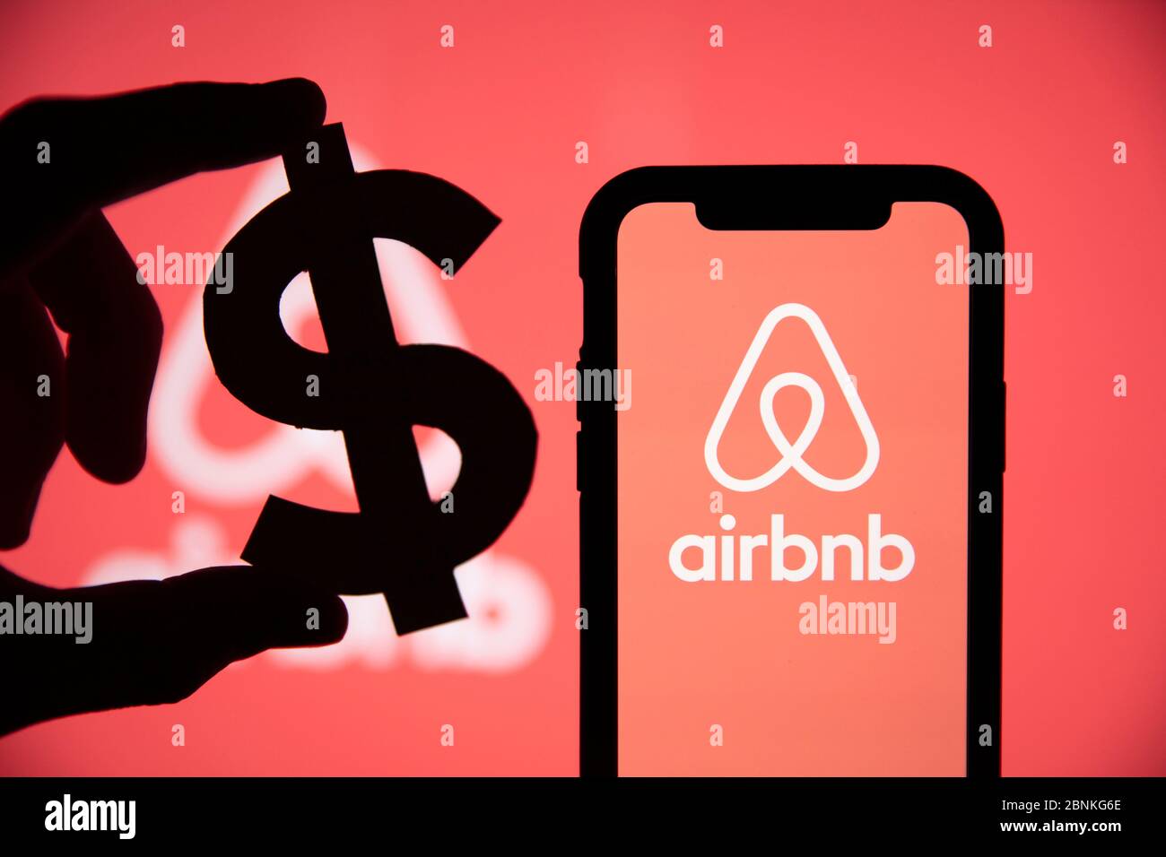 LONDON, UK - May 15 2020: Airbnb home vacation rental logo with a dollar symbol Stock Photo