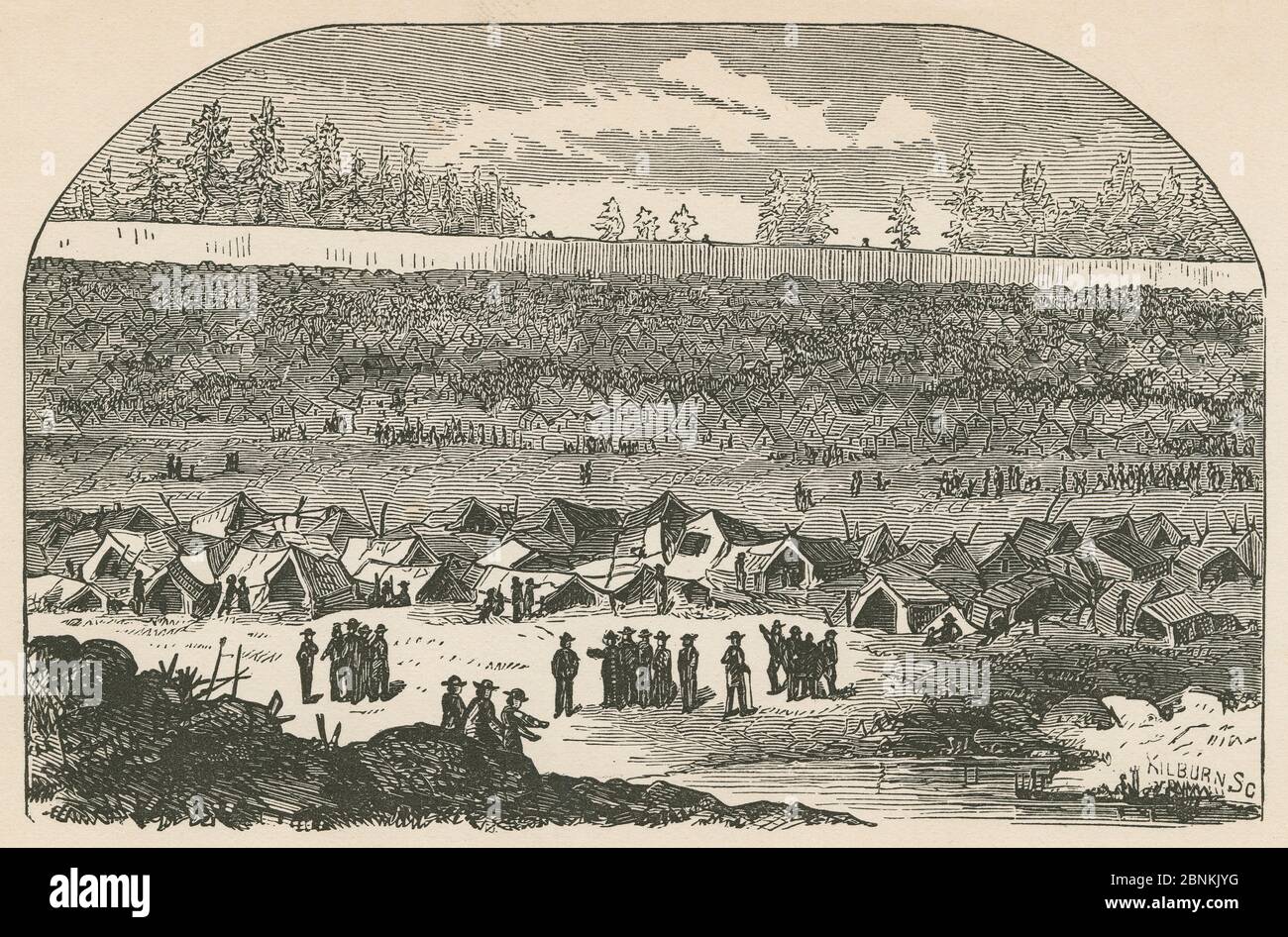 Antique 1866 engraving, “view of the interior of the prison, with quagmire and crowds of huts and men beyond” from The Soldier’s Story by Goss. “The space thus filled in was occupied, almost to the very verge of the sink, by the prisoners, gathered here for the conveniences of the place, and for obtaining water.” Andersonville Prison was a Confederate prisoner of war camp in Andersonville, Georgia, during the American Civil War. SOURCE: ORIGINAL ENGRAVING Stock Photo