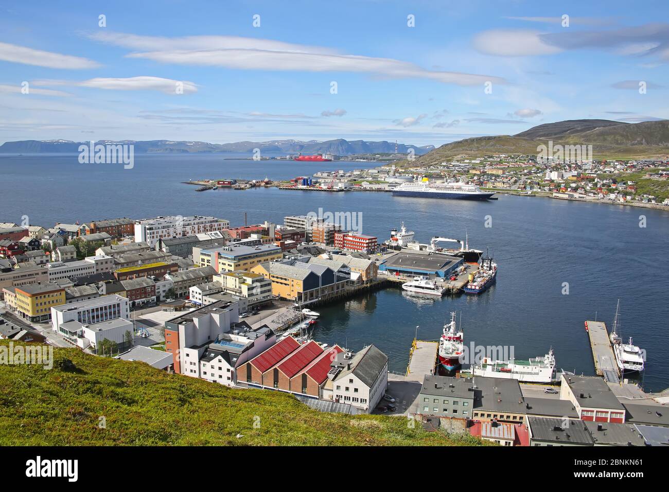 Town of Hammerfest with the downtown area, port, cruise ships & mountains in the background. Hammerfest is the northernmost town in the world with mor Stock Photo