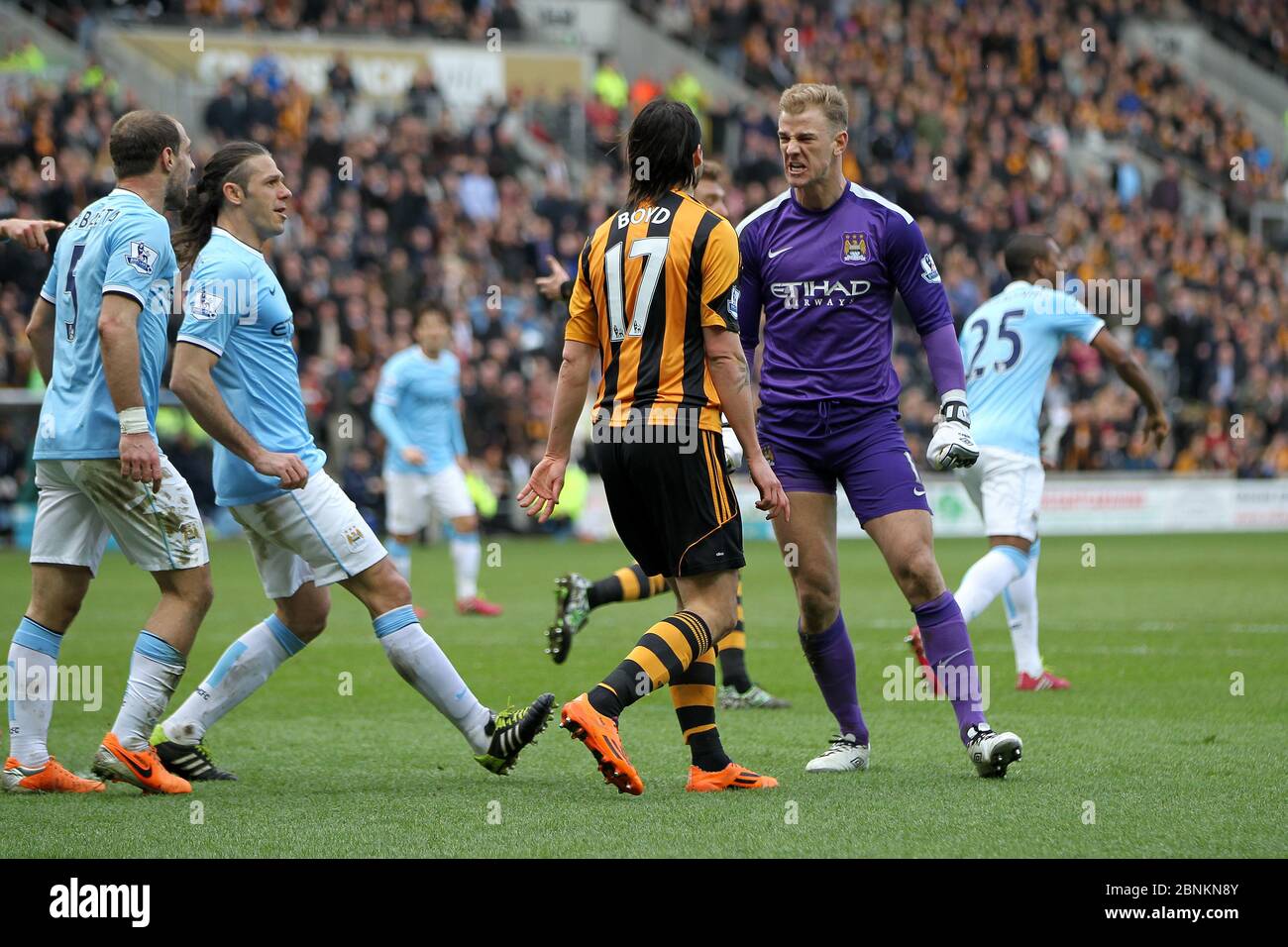 KINGSTON UPON HULL, ENGLAND - Manchester City's Joe Hart reacts after George Boyd of Hull City goes down in the penalty area after his challenge during the Premier League match between Hull City and Manchester City at the KC Stadium, Kingston upon Hull on Saturday 15th March 2014 (Credit: Mark Fletcher | MI News) Stock Photo