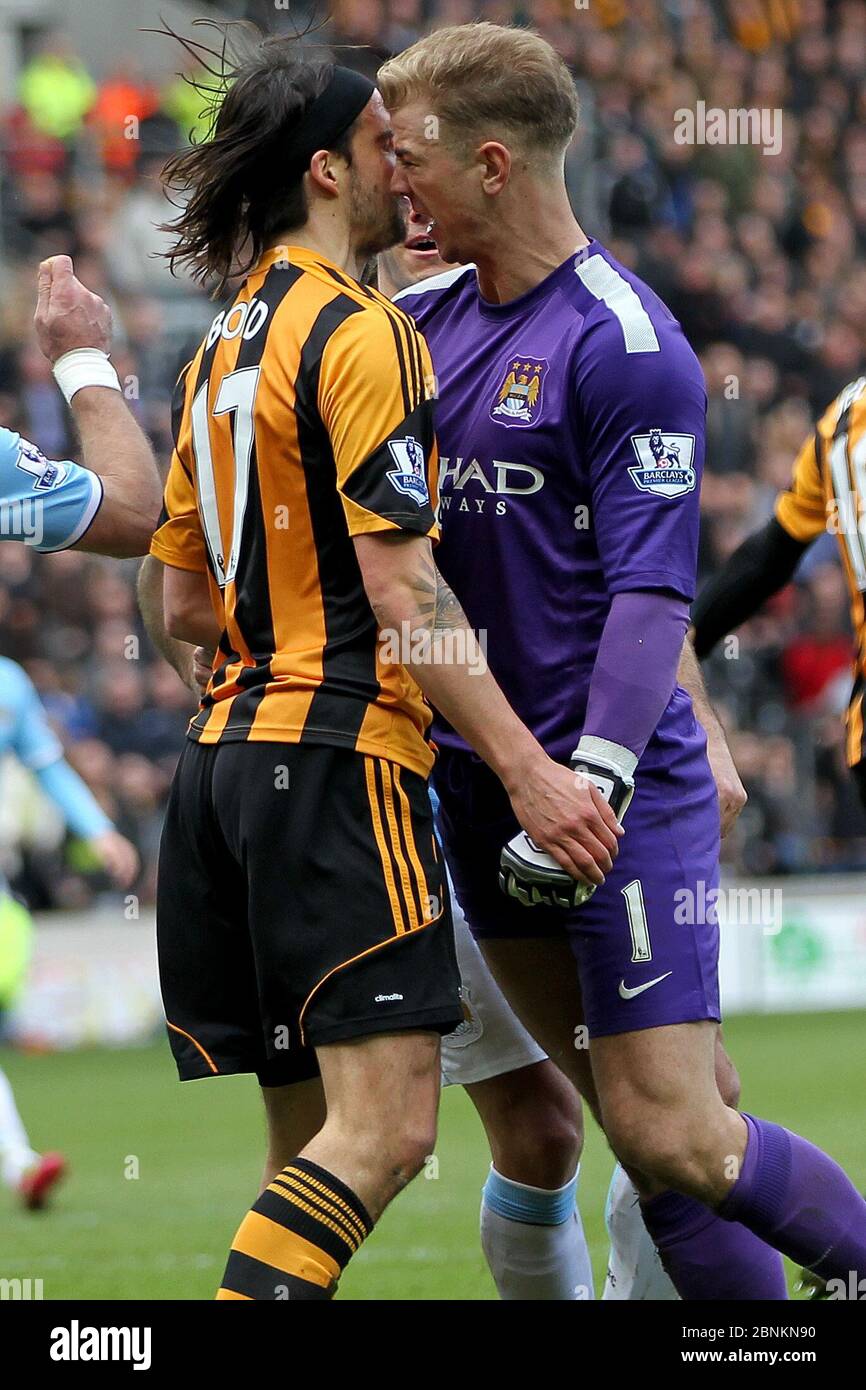 KINGSTON UPON HULL, ENGLAND - Manchester City's Joe Hart appears to headbutt George Boyd of Hull City after he went down in the penalty area after a challenge by Hart during the Premier League match between Hull City and Manchester City at the KC Stadium, Kingston upon Hull on Saturday 15th March 2014 (Credit: Mark Fletcher | MI News) Stock Photo