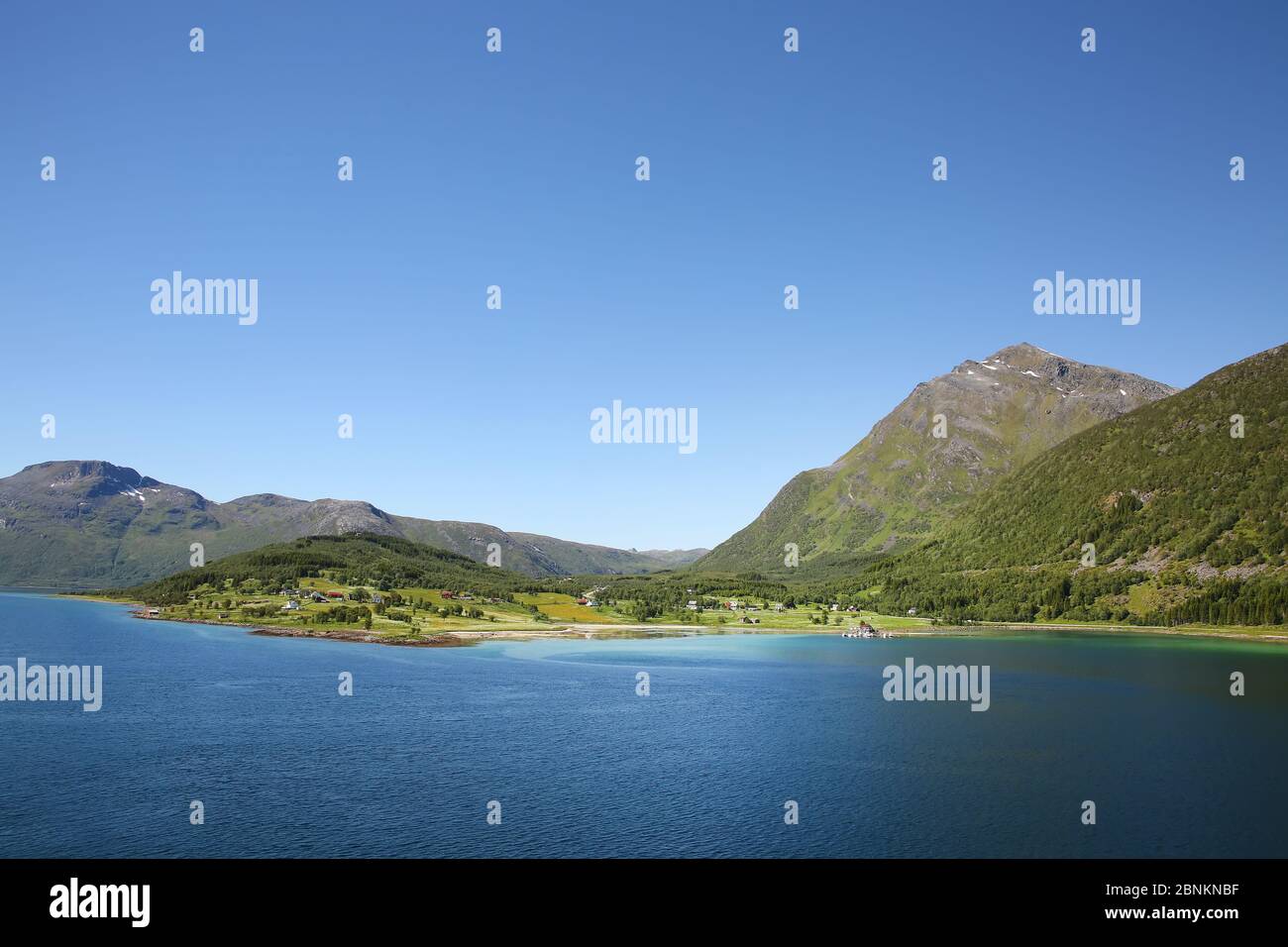Beautiful scenic landscape of fjords, islands, village & inside passages; the Andfjorden & Vestfjorden, between Bodo & Hammerfest, Norway. Stock Photo