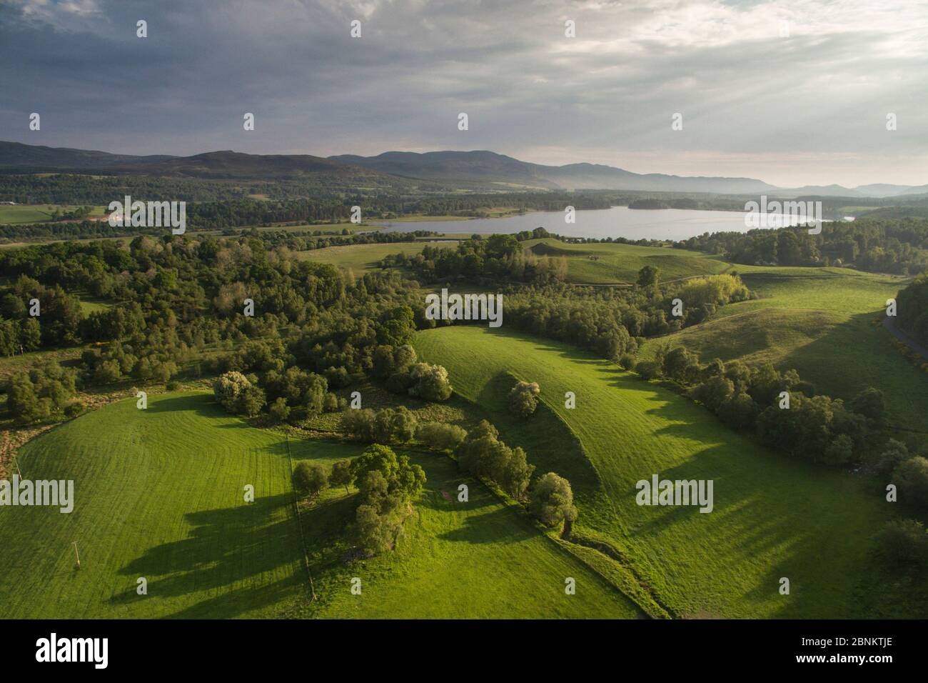 Aerial view over northern end of Insh Marshes National Nature Reserve to Loch Insh, Cairngorms National Park, Scotland, UK, June 2016. Stock Photo
