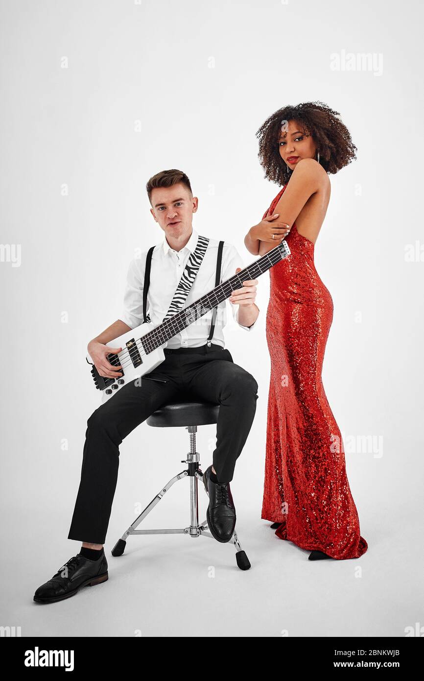 Multiracial music band performing in a recording studio Stock Photo - Alamy