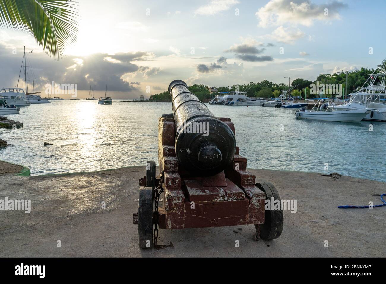 America, Caribbean, Greater Antilles, Dominican Republic, La Altagracia Province, Bayahibe, Historic cannon in Bayahibe Bay Stock Photo