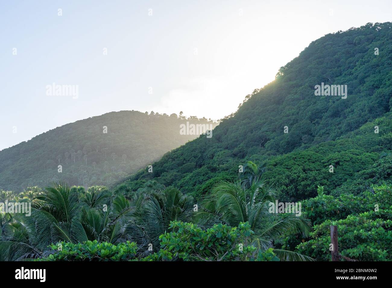 America, Caribbean, Greater Antilles, Dominican Republic, Barahona, Los Patos, sunset behind the mountain forest at Los Patos beach Stock Photo