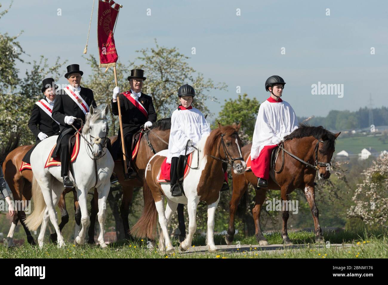 Altar servers riding horses during the Blutritt (the right of blood ...